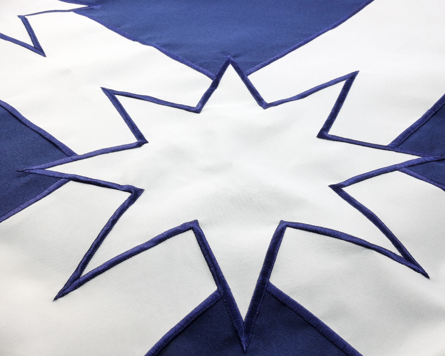 Eureka Stockade flag close up of embroidered white Southern Cross star on blue fabric