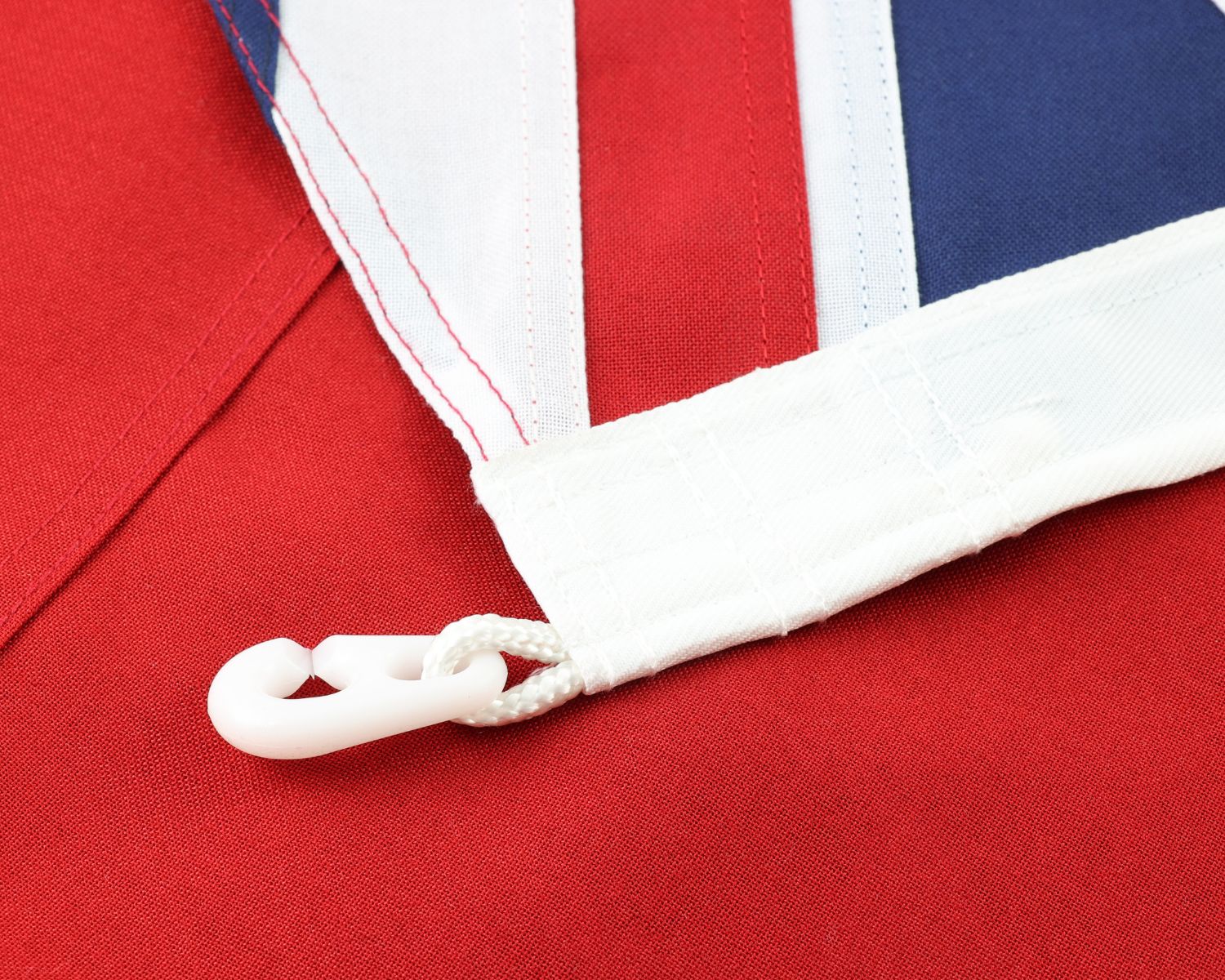 Reinforced white canvas header and plastic clip toggle attachment on the 1901-1903 Australian Red Ensign.