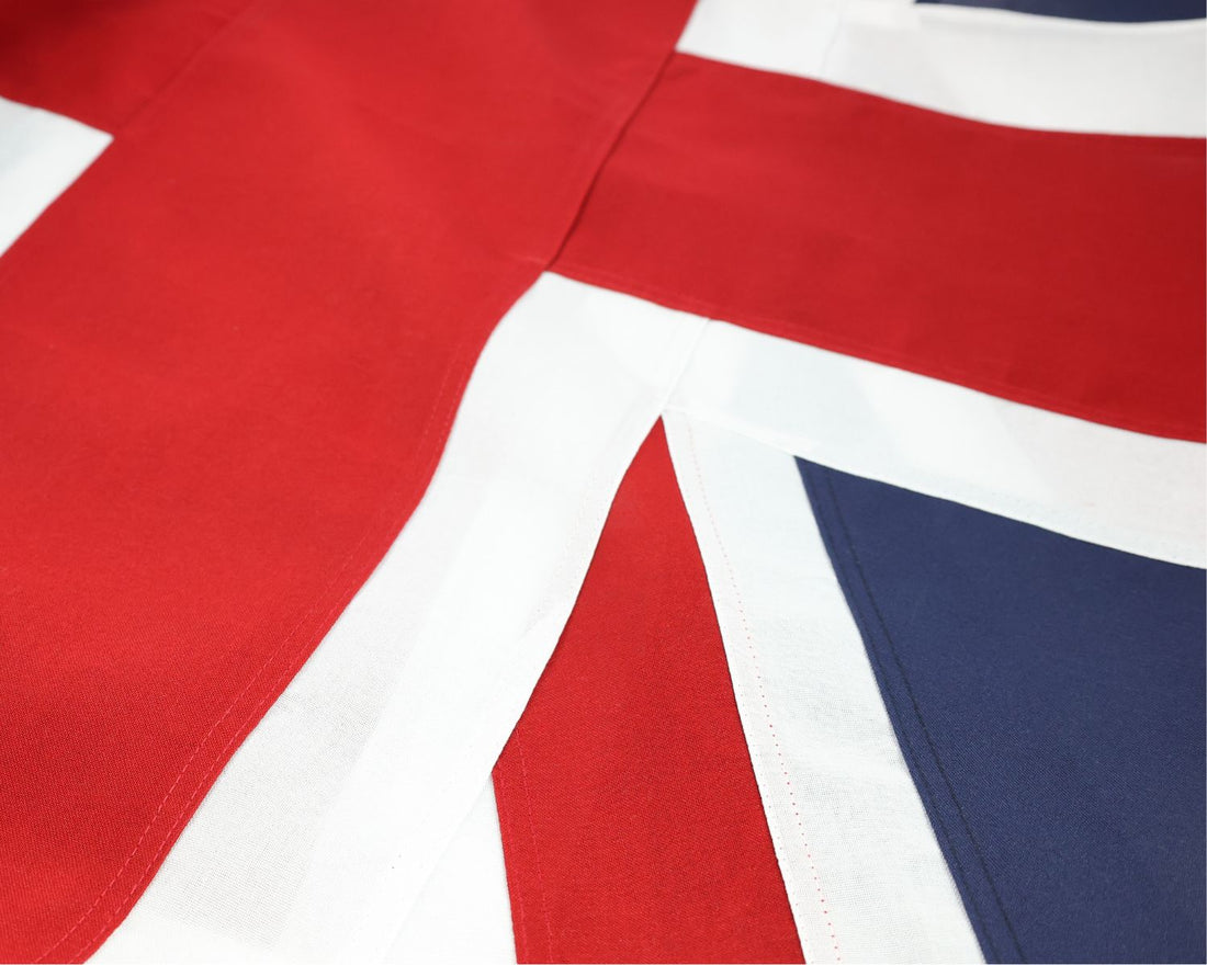 Close-up of the fully sewn United Kingdom flag showing the red, white and blue fabric panels.